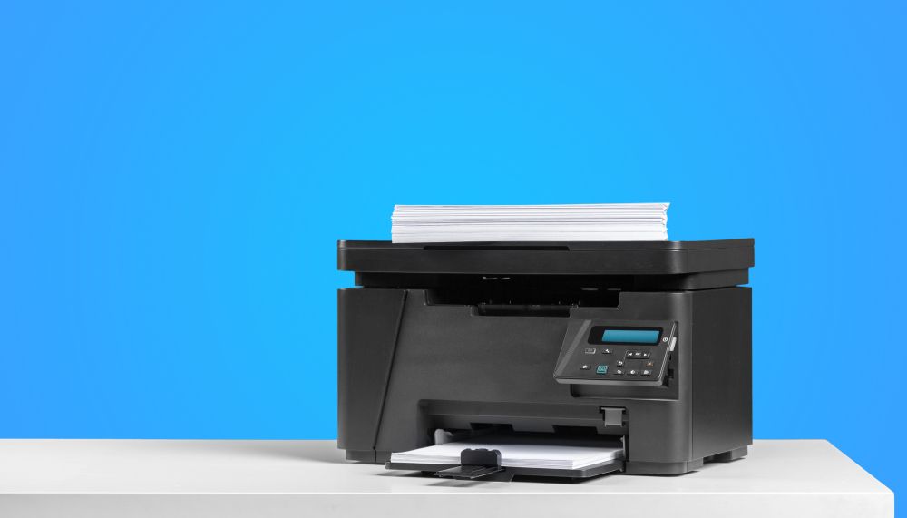 Old printer on blue background