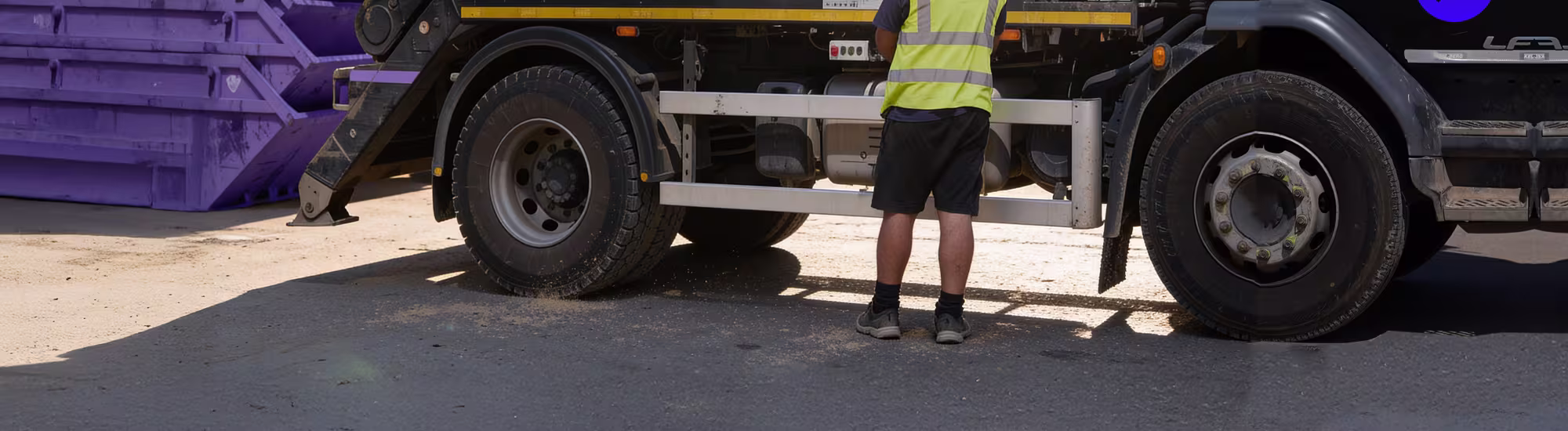 Justhire Skip Lorry With Purple Skip On The Lorry