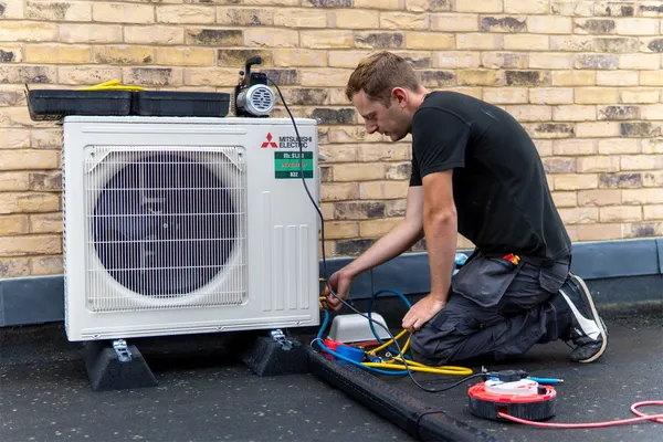 Aircon Technician On Roof